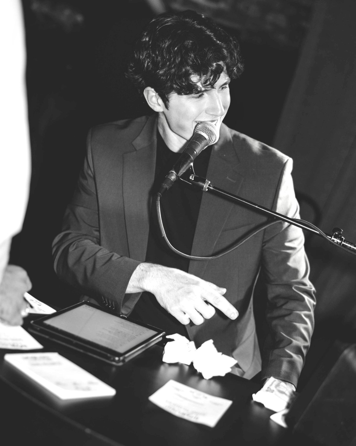 Nathan singing into the mic mid-show